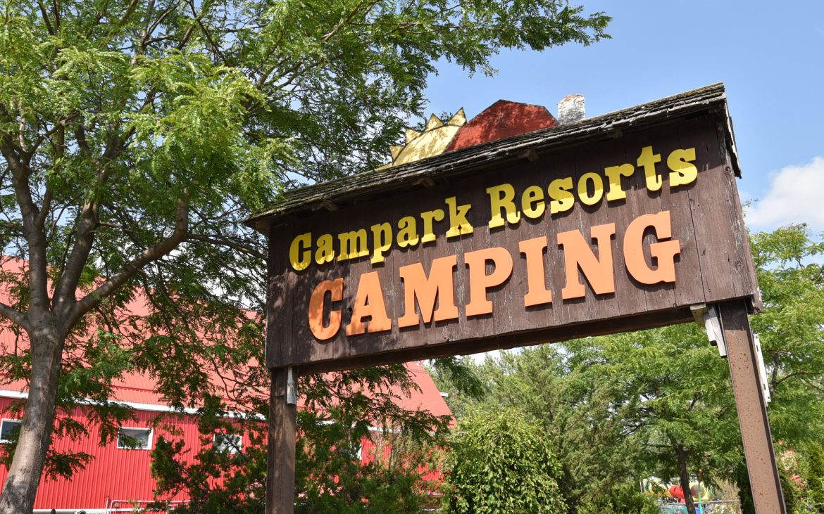 Campark Resort sign against a blue sky,