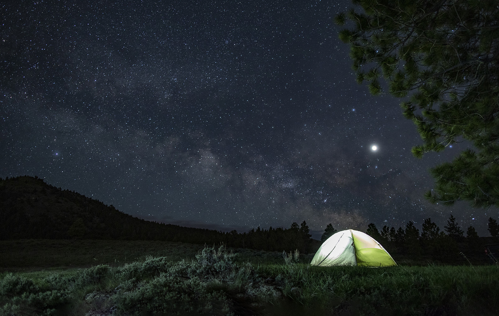 Bryce Canyon Country — A glowing dome tent under a starry sky.