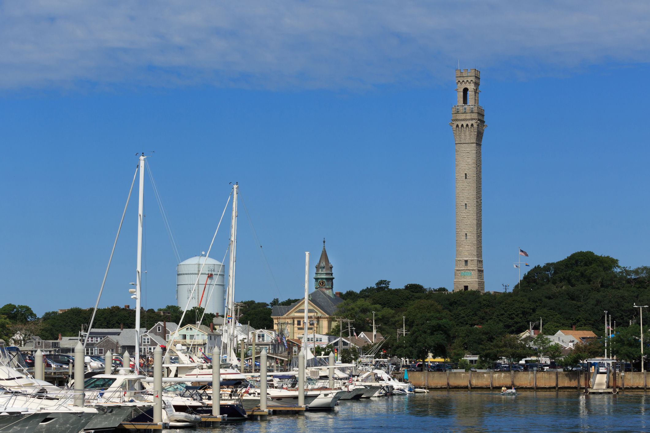 Granite tower overlooks a bay crowded with sailboats.