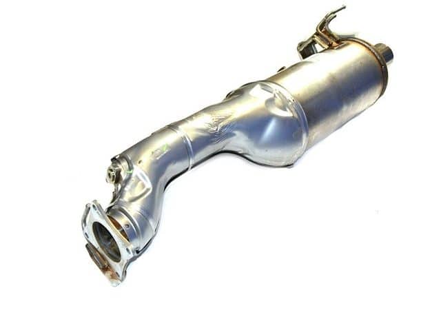 A silver catalytic converter against a white background.