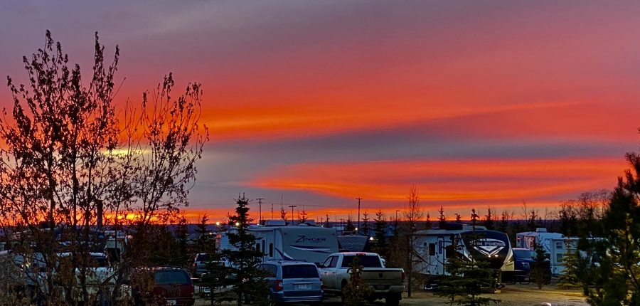 A sunset sky over an RV park.