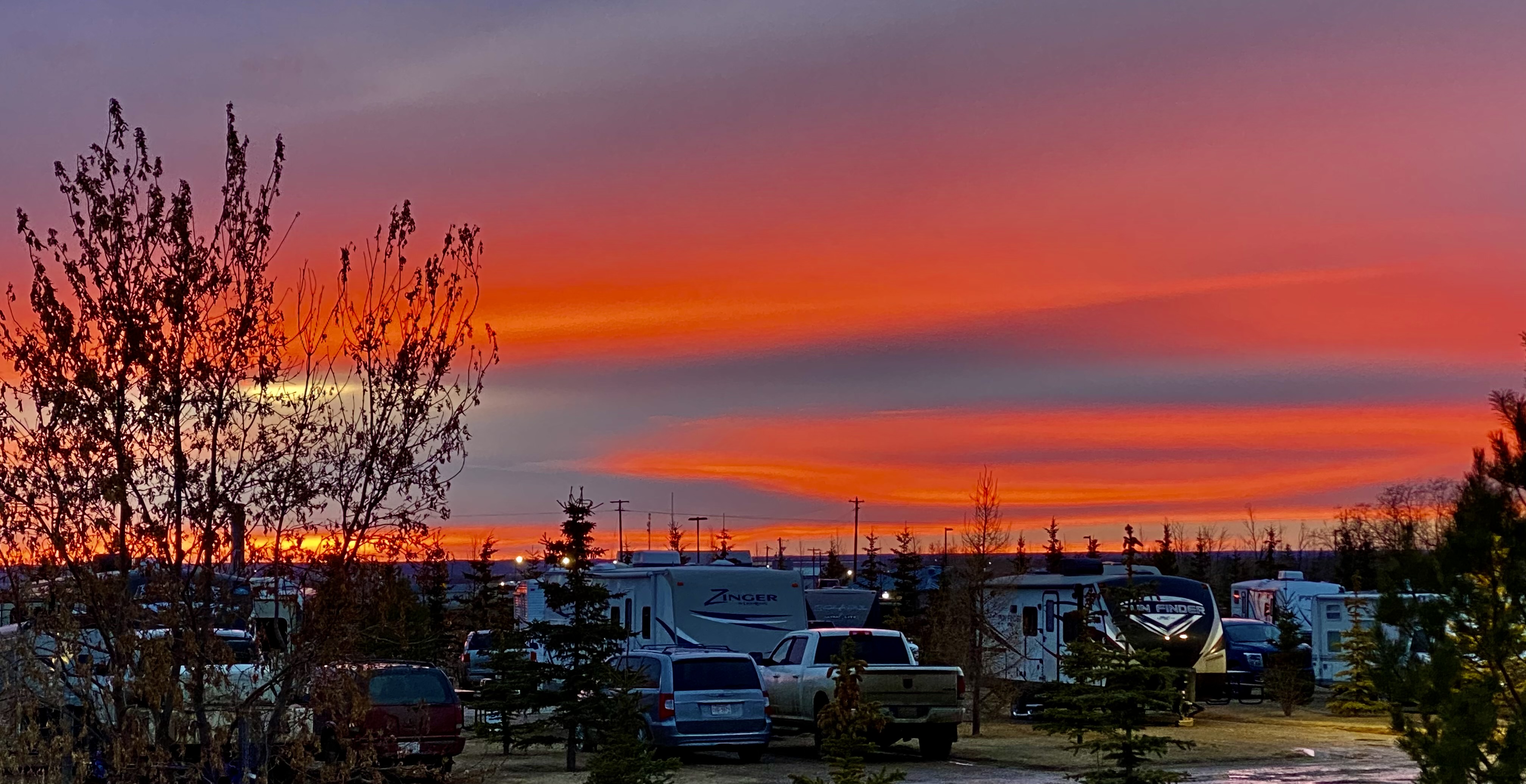 A sunset sky over an RV park.
