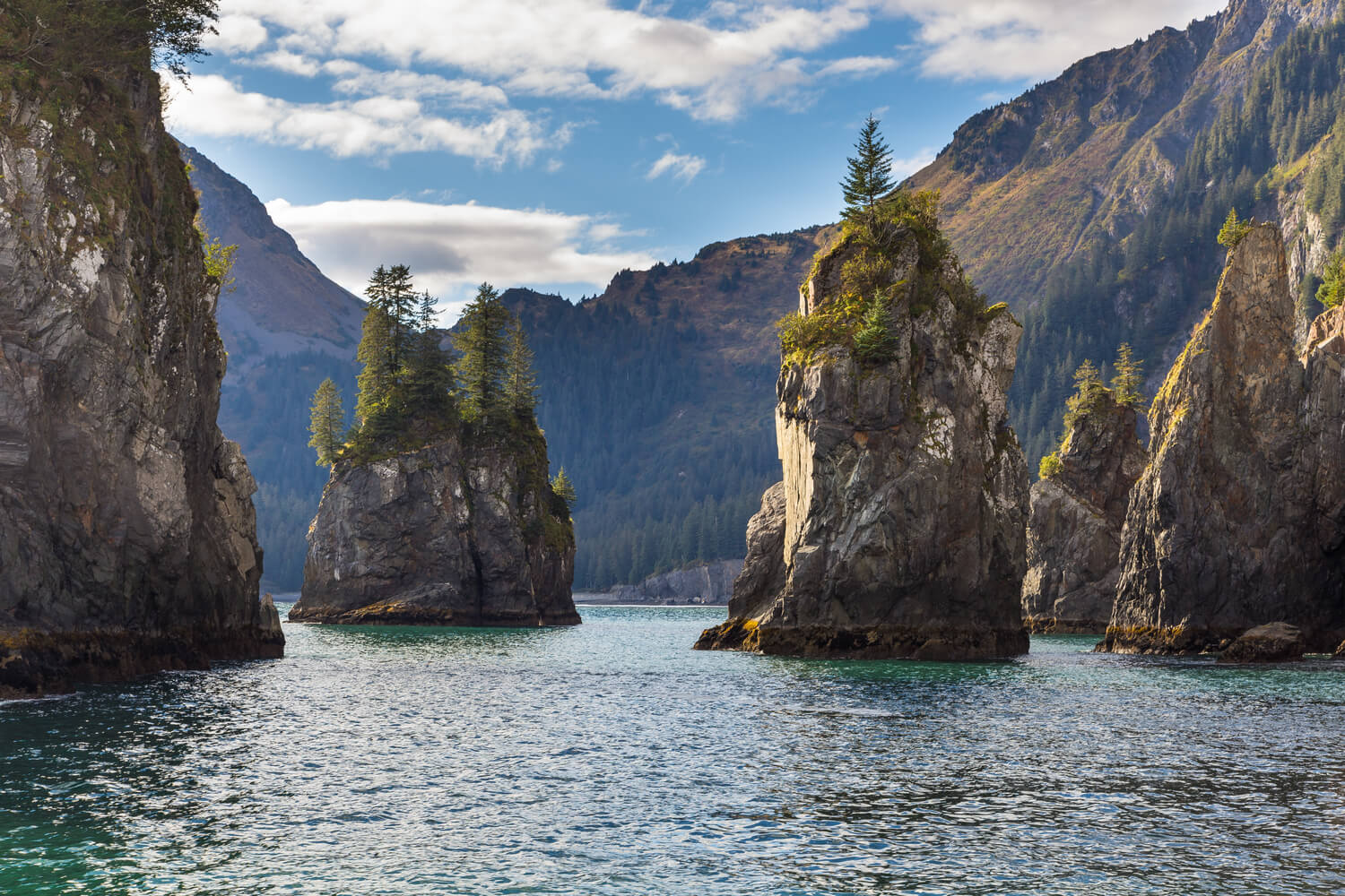 Rock spires emerge from an inlet.