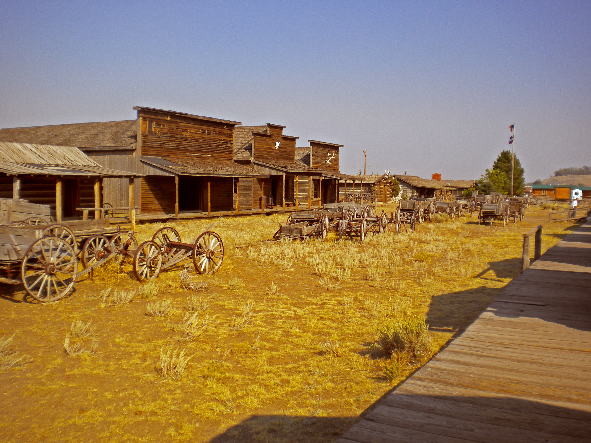 A deserted dirt street in an Old West ghost town.