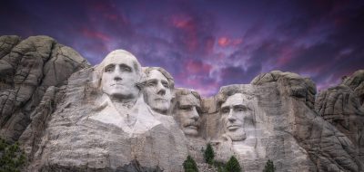 Four presidents carved into a cliff face.
