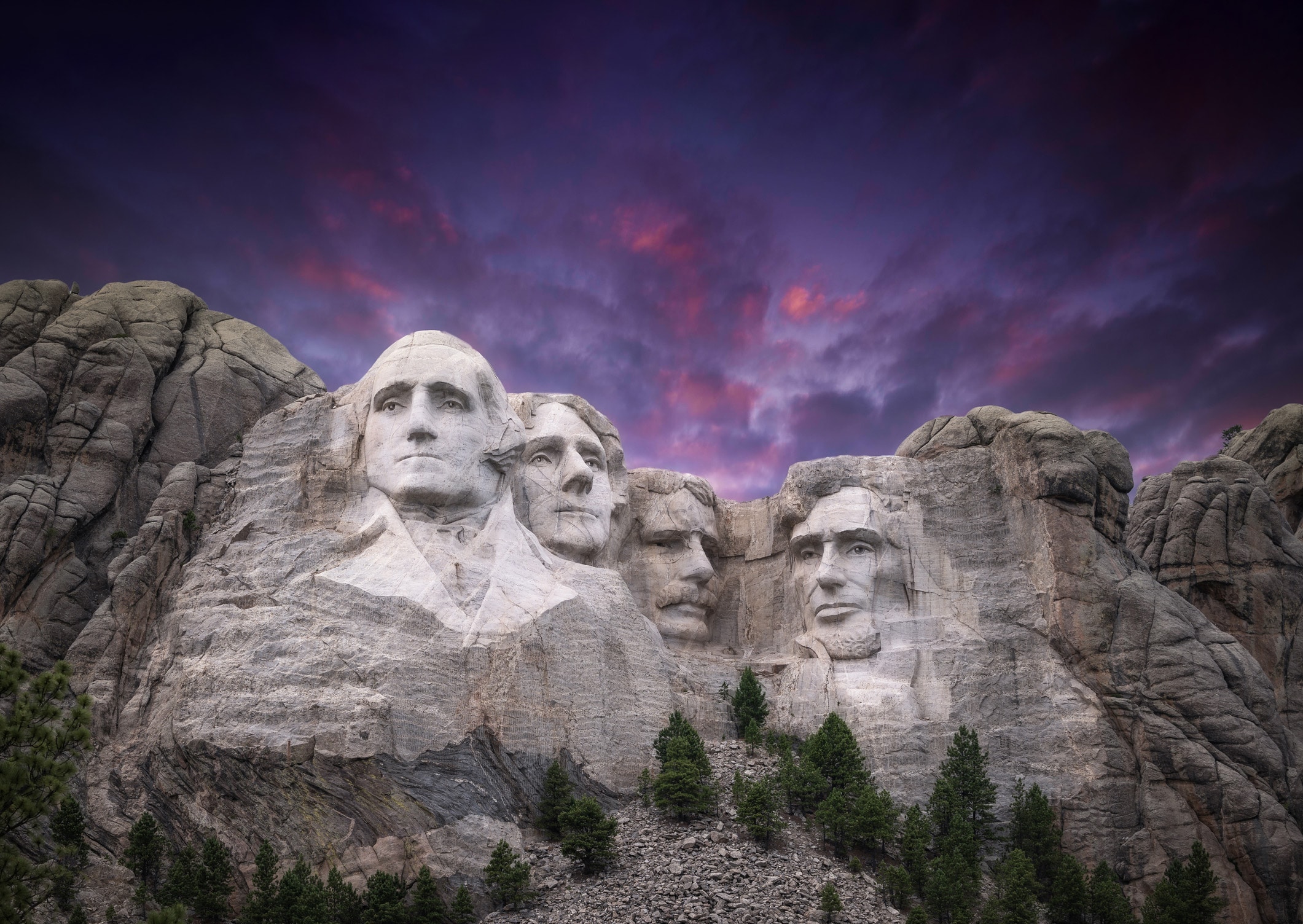 Four presidents carved into a cliff face.