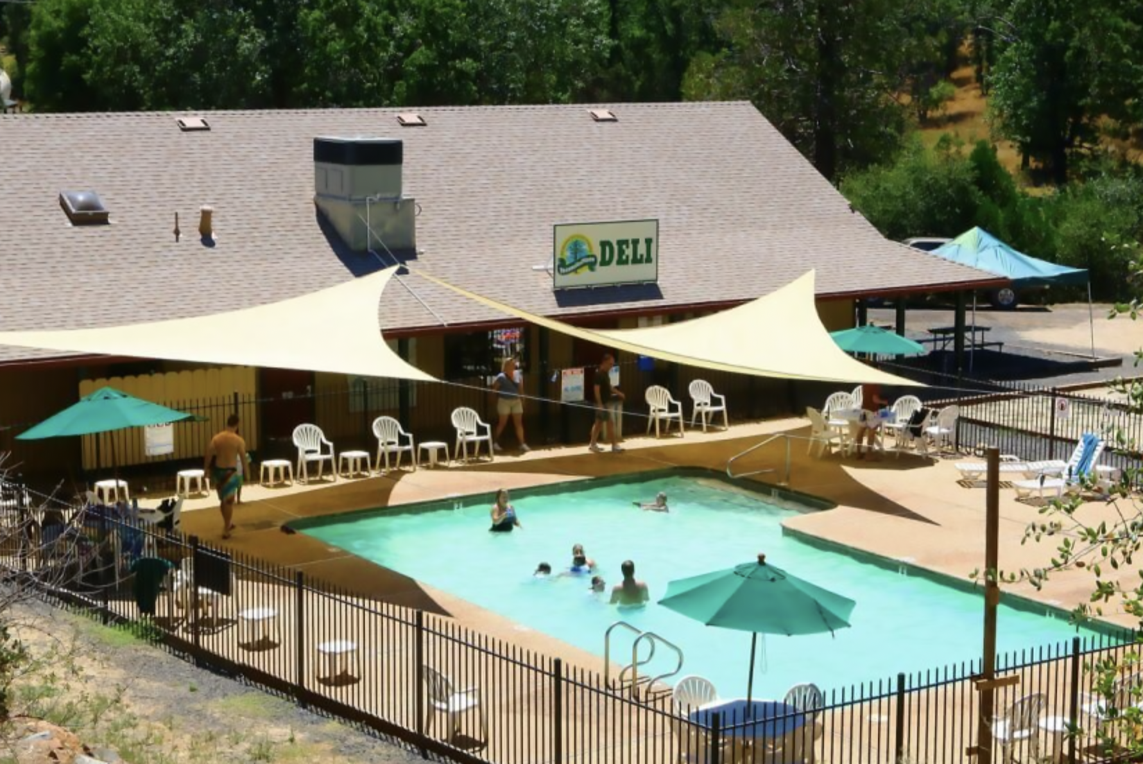 Aerial shot of swimming pool and deli.