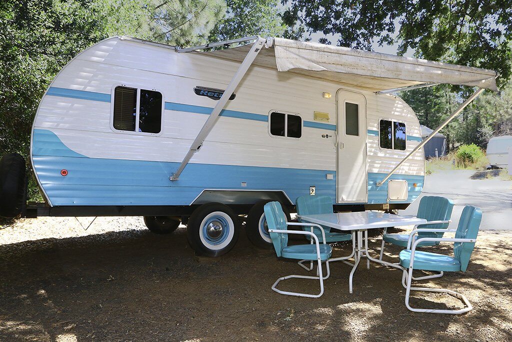 A trailer with blue and white paint scheme.