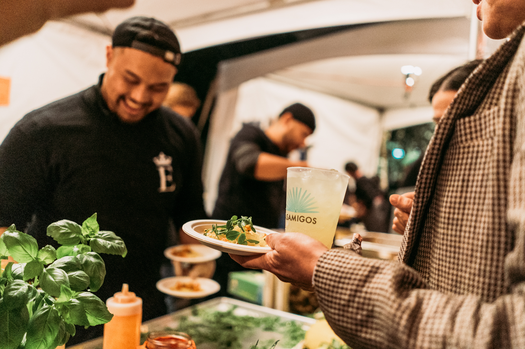 A chef prepares gourmet tacos for hungry customers.