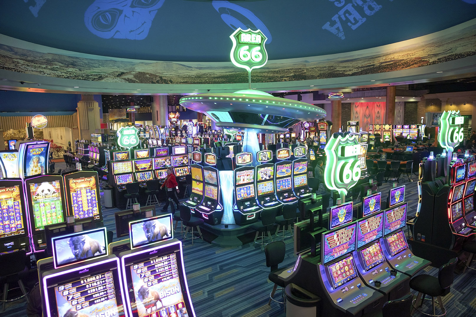 Slot machines light up a casino floor.