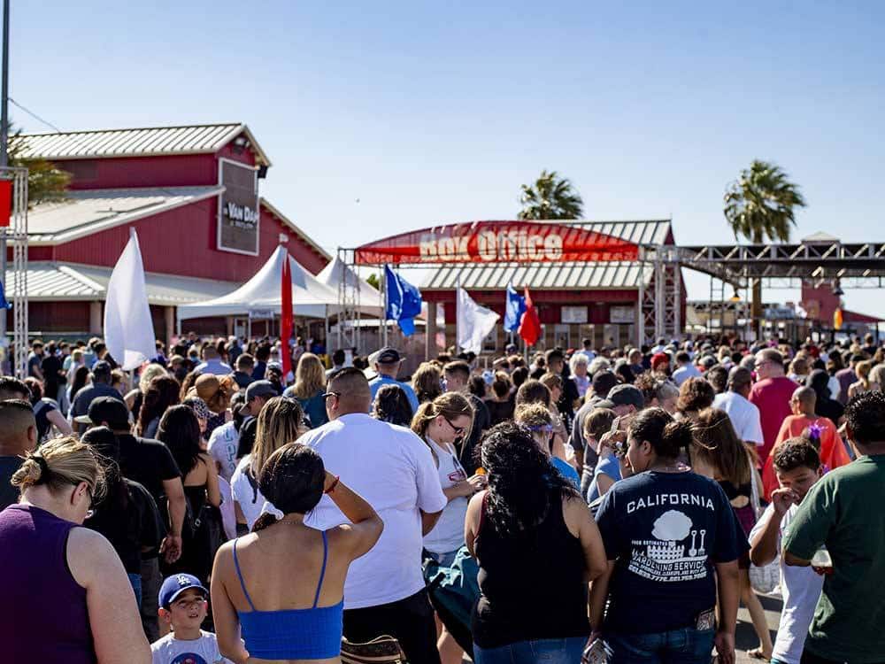 A crowd at a fairgrounds.