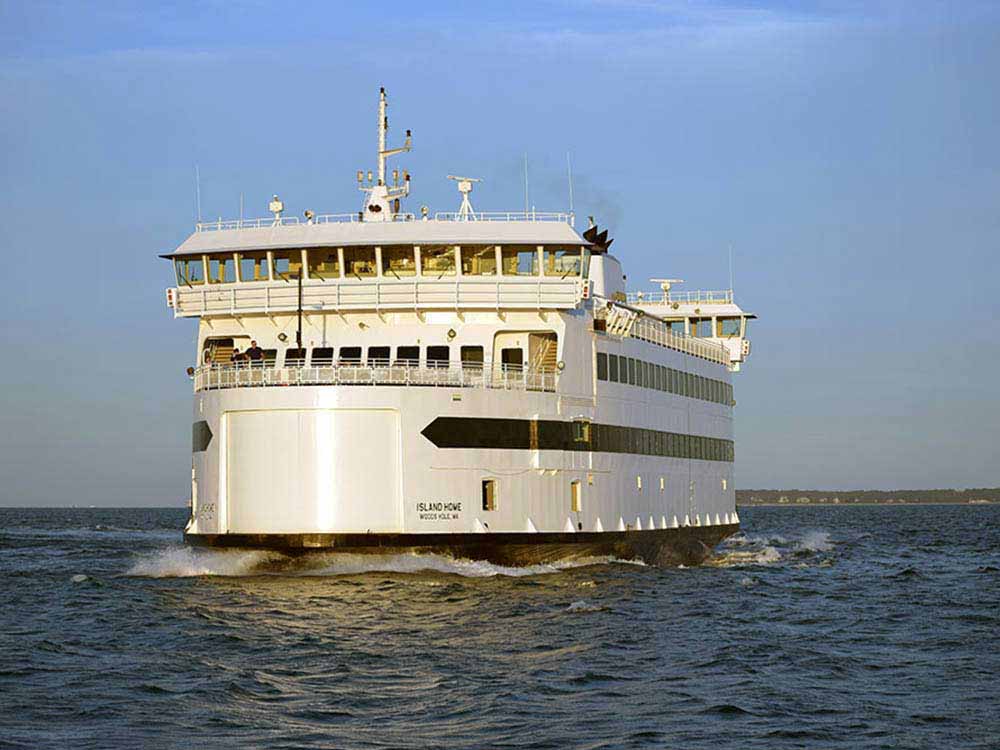 A ferry churns across open water.