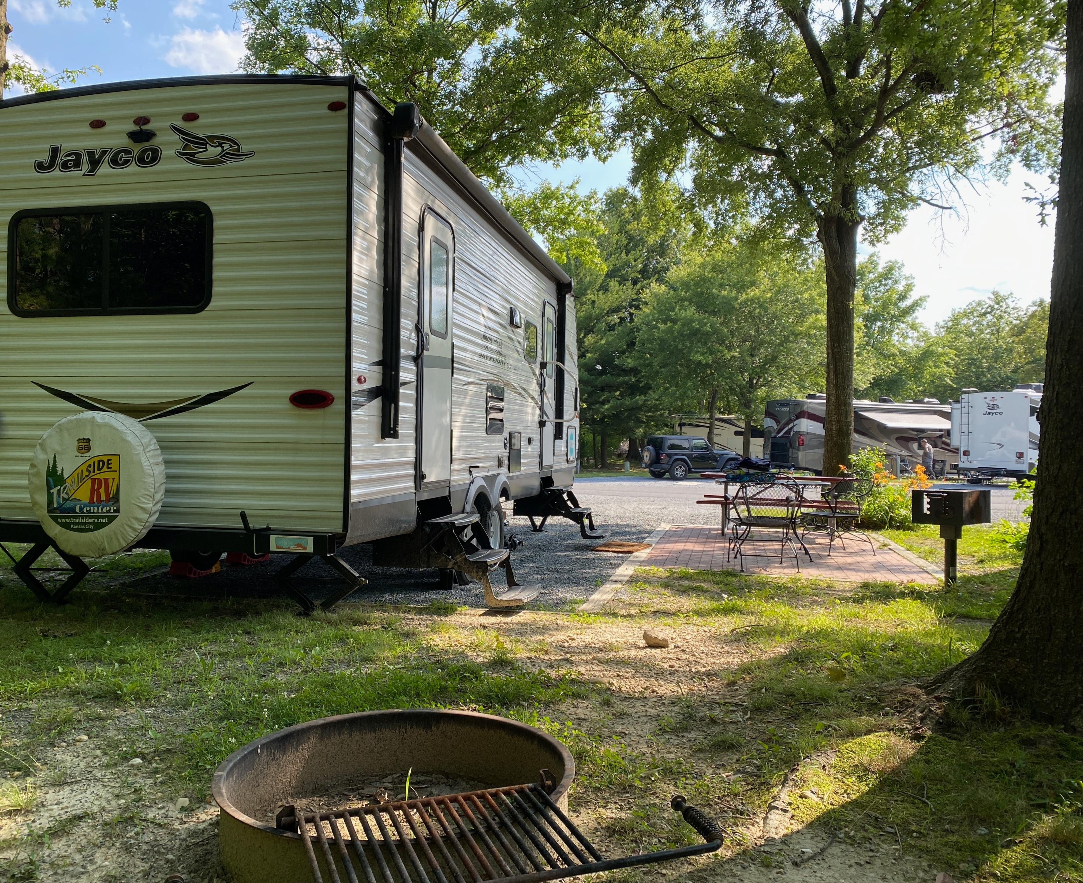 View from behind of RV trailer in a campsite.