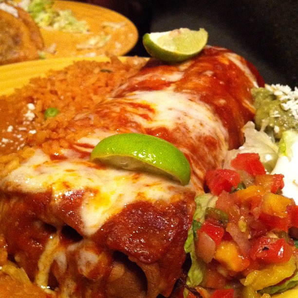 Succulent chimichanga covered with cheese.