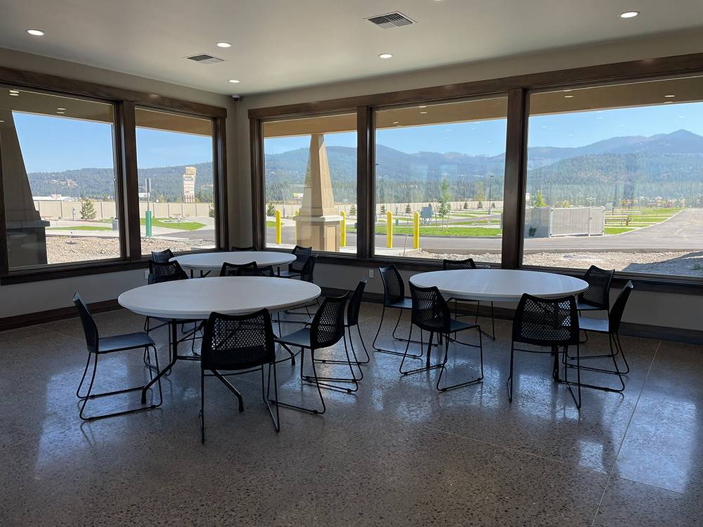 An indoor dining area looking out an an RV park.