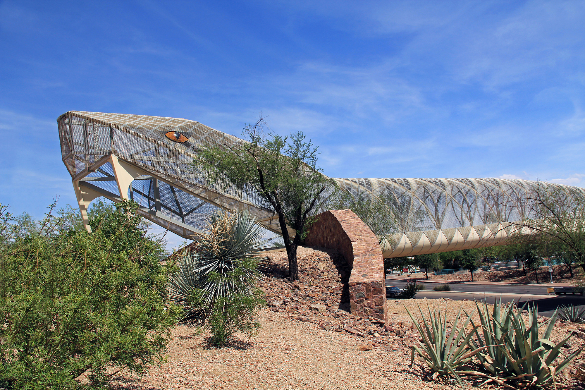 Head end of the diamondback rattlesnake bicycle and pedestrian covered bridge over Broadway Blvd. at the Barraza-Aviation Parkway, just east of downtown Tucson, Arizona.