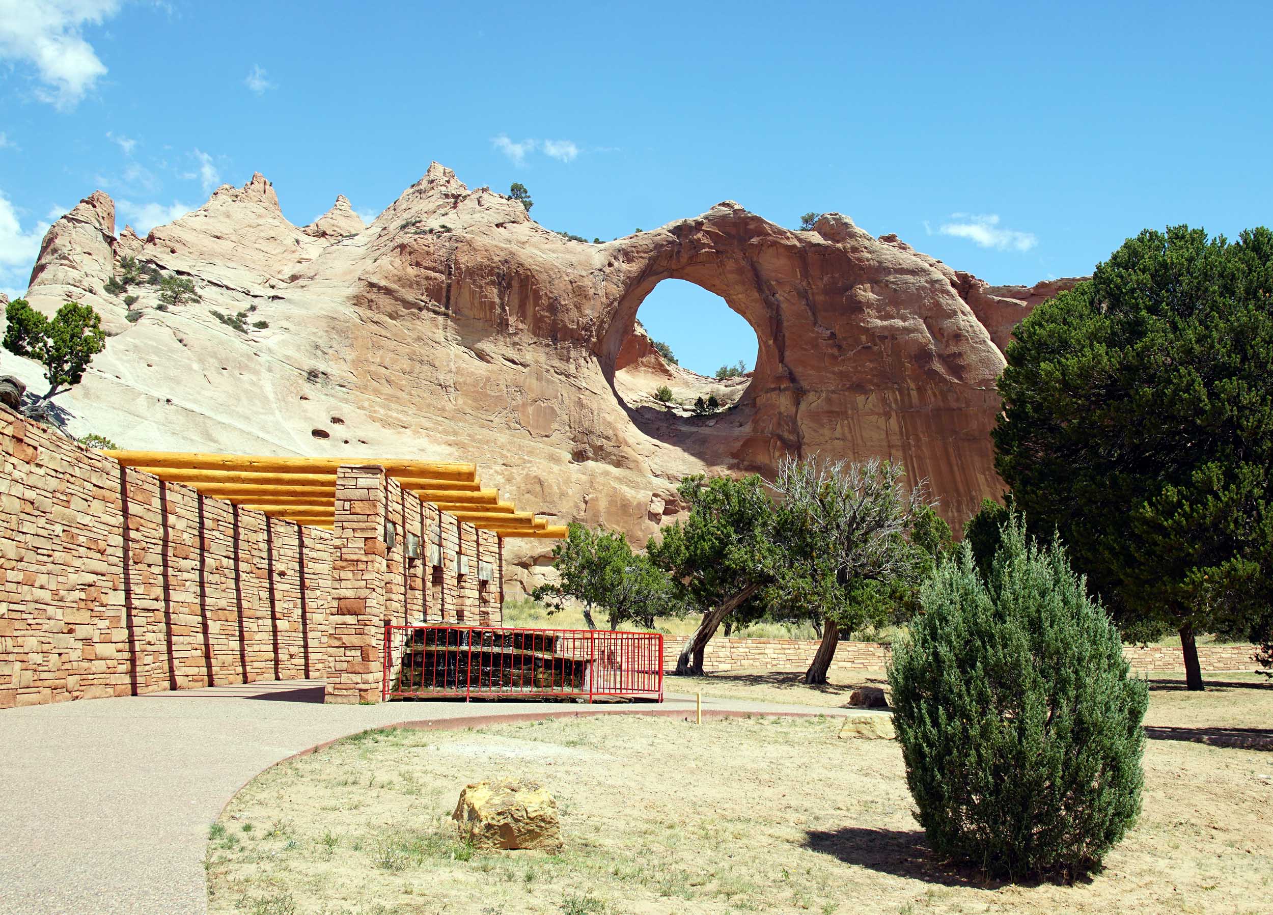 Hole in a rock overlooking a museum.