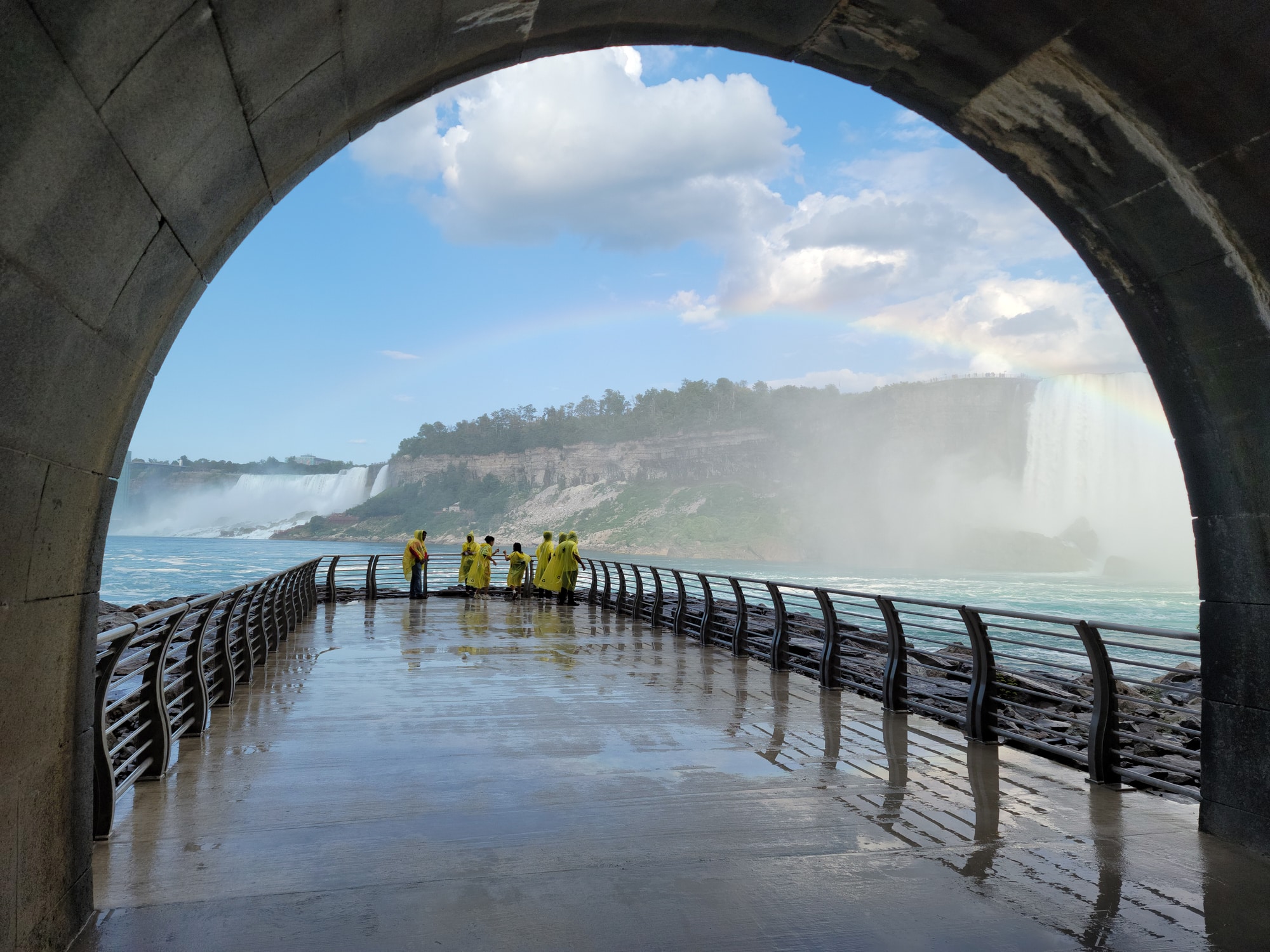 A tunnel leading to an observation deck of huge waterfalls.