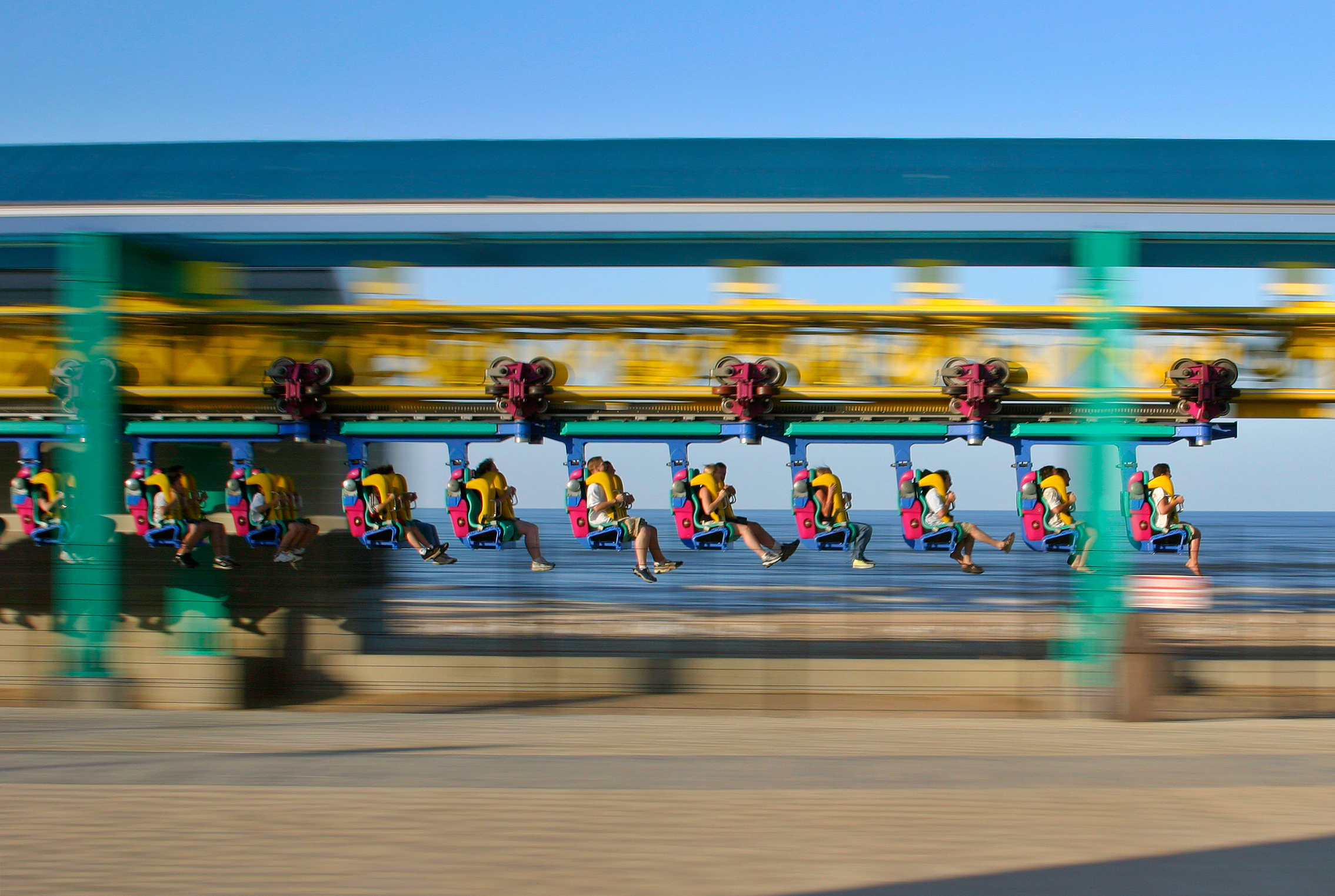 Riders on a fast roller coaster.