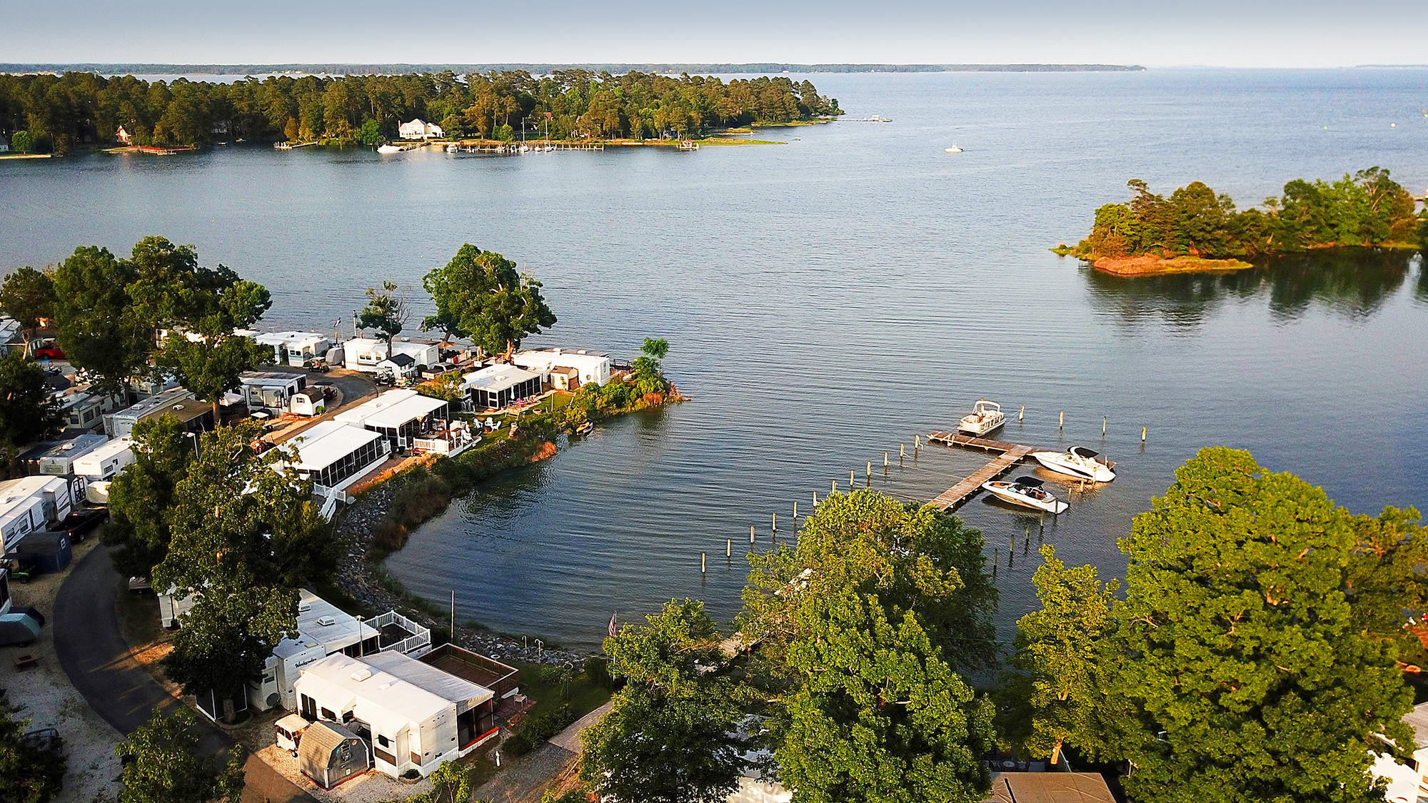 Aerial view of marina with L-shaped dock.