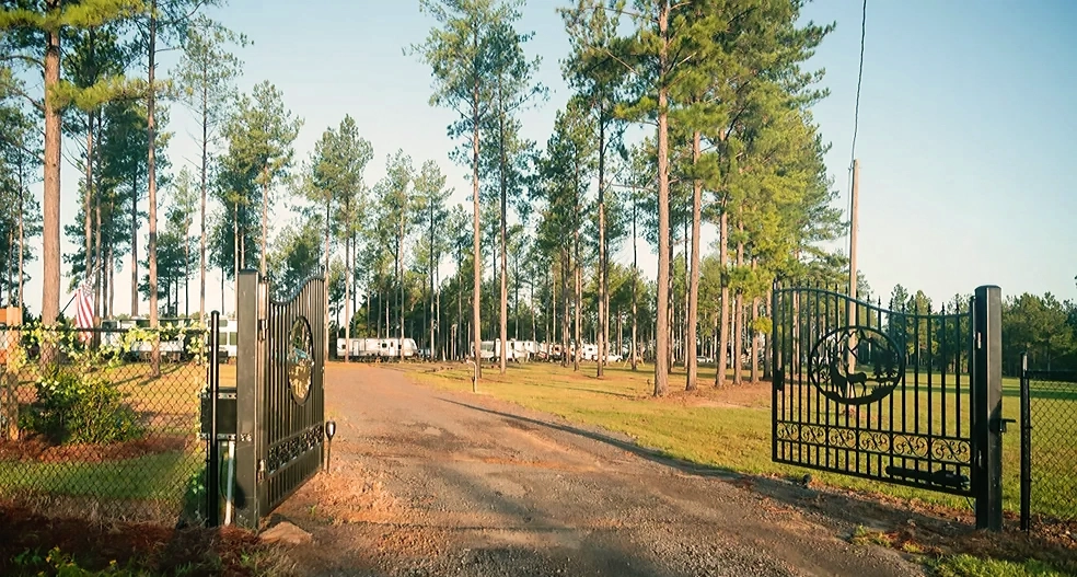 Wrought-iron entrance gate to RV park.