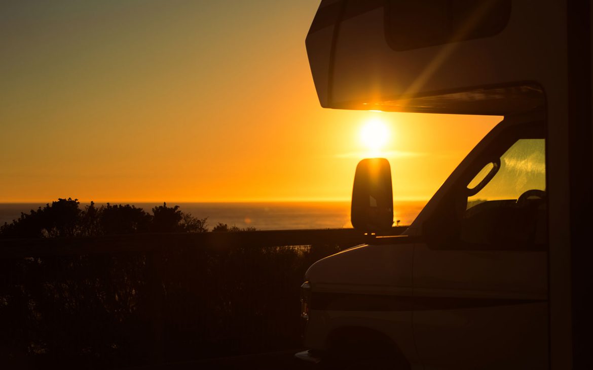Silhouette of RV during sunset.