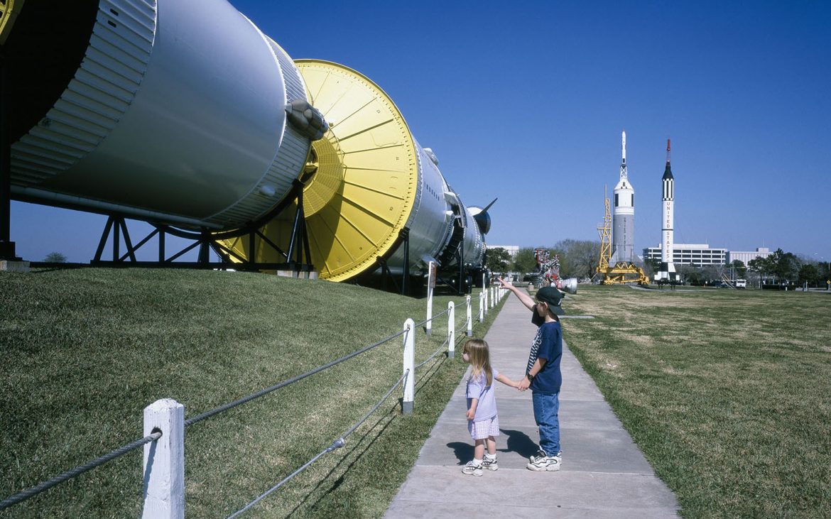 Two kids marvel at a rocket