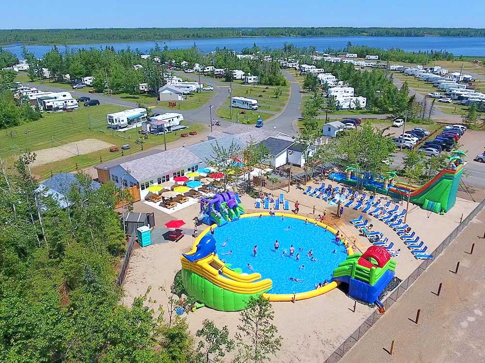 Aerial view of RV resort with a circular pool in the middle