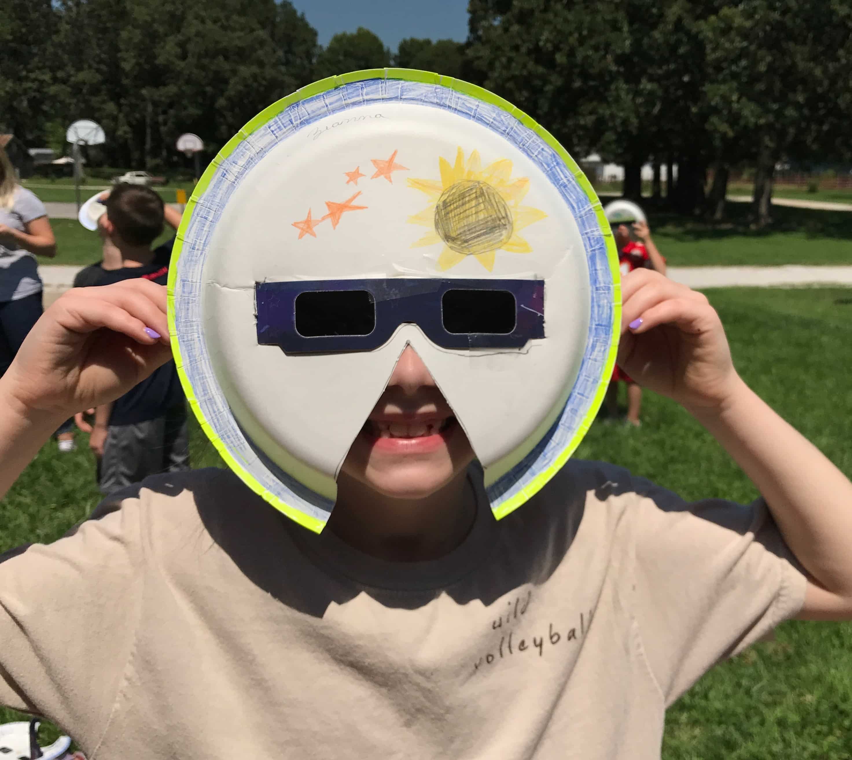 Kid with modified eclipse-watching gear