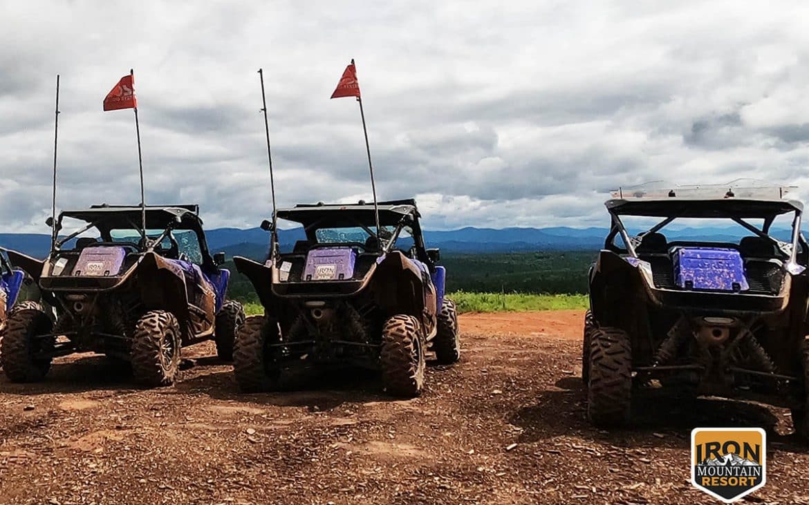 Three offroad vehicles lined up and ready for action.