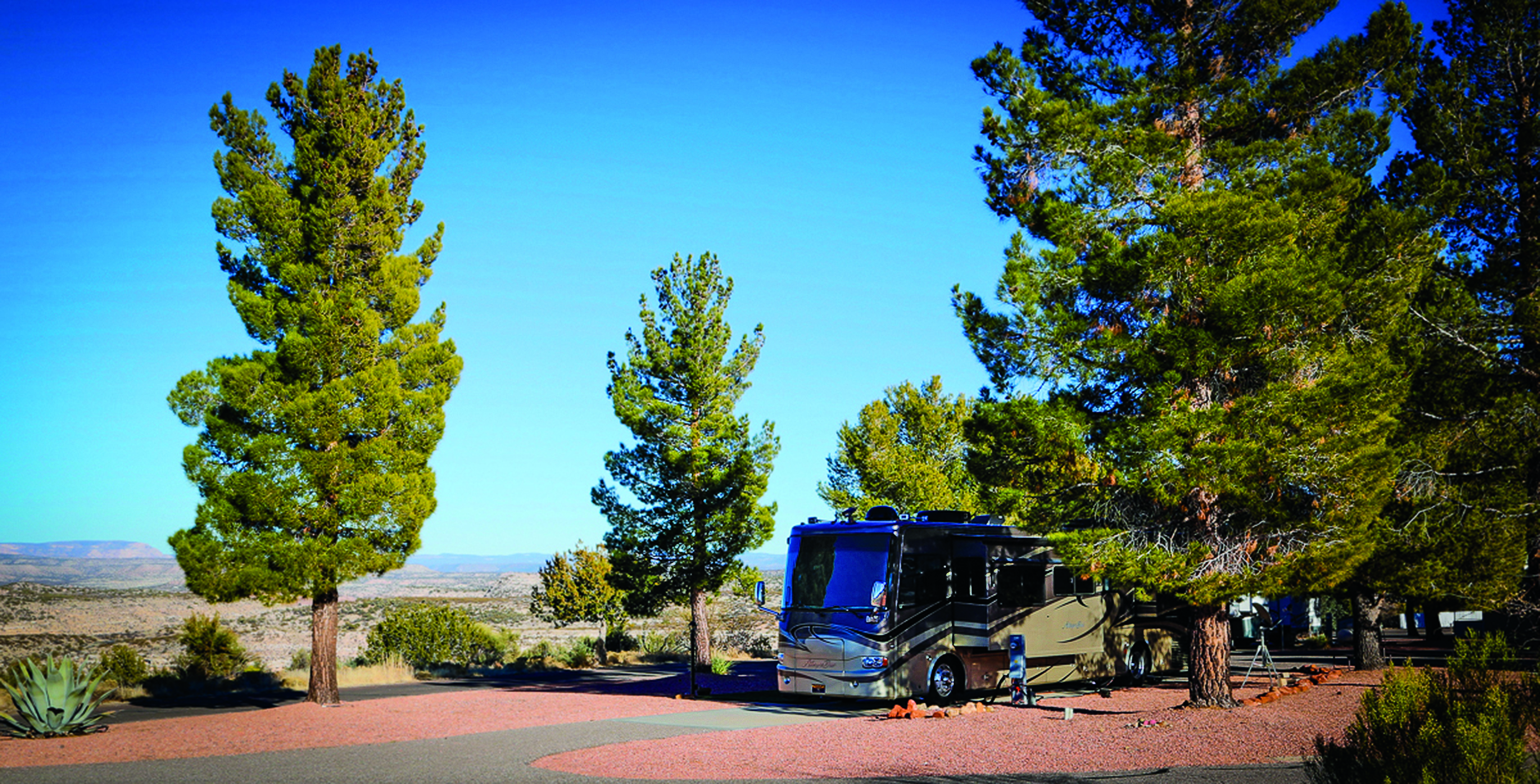 Motorhome in in a campground with beautiful vista.